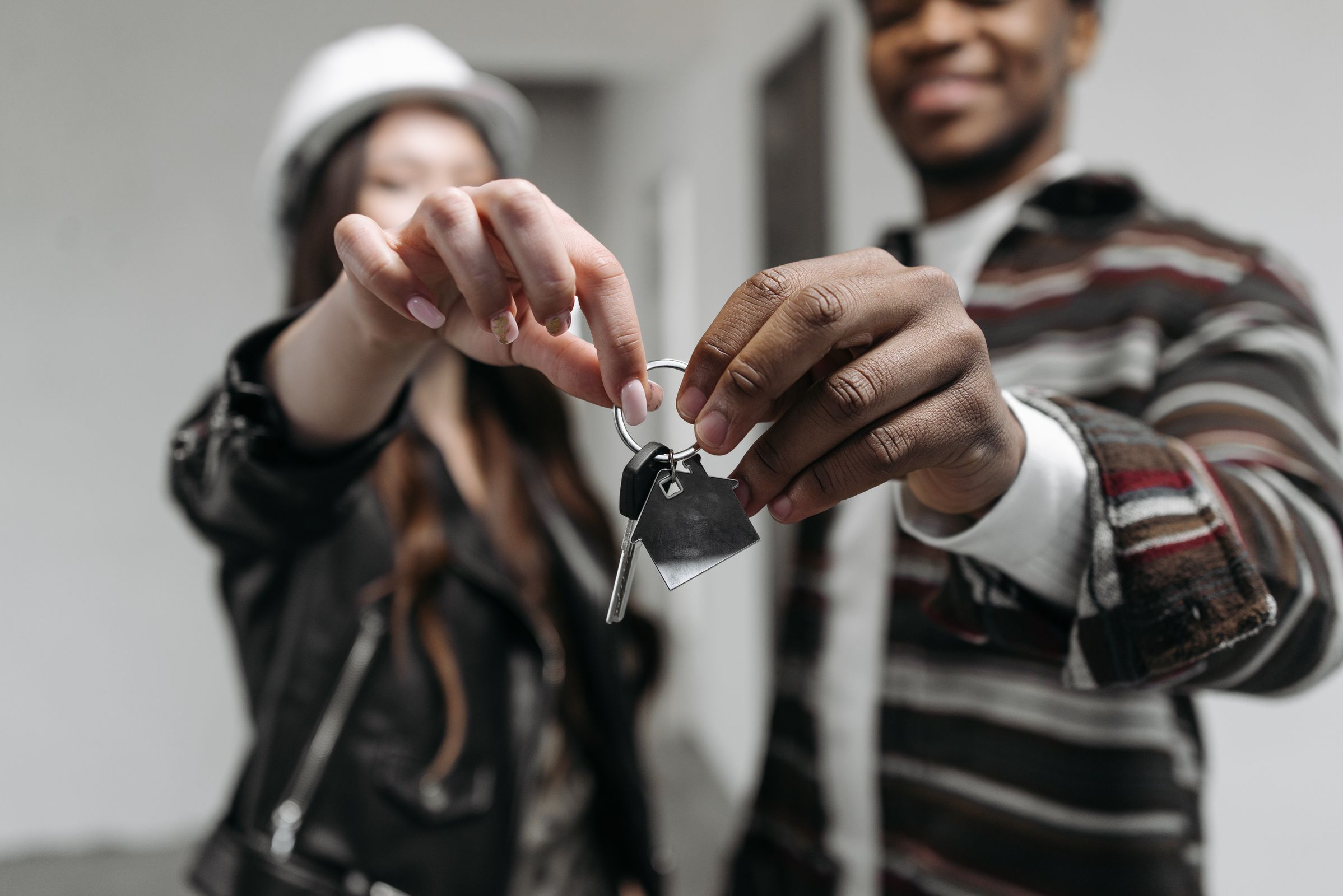 A couple holding the keys to their new home